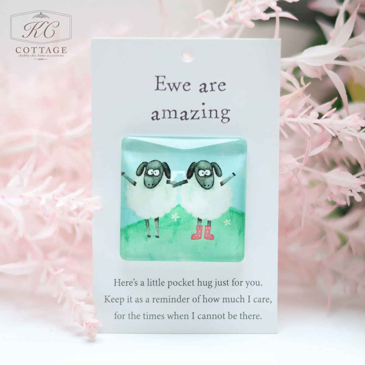 A small card with "Ewe are amazing" written at the top and a small illustration of two hugging sheep beneath it. Below the illustration, a message reads: "Here's a little pocket hug just for you. Keep it as a reminder of how much I care, for the times when I cannot be there." Perfect for Pocket Hugs with Sentiments.